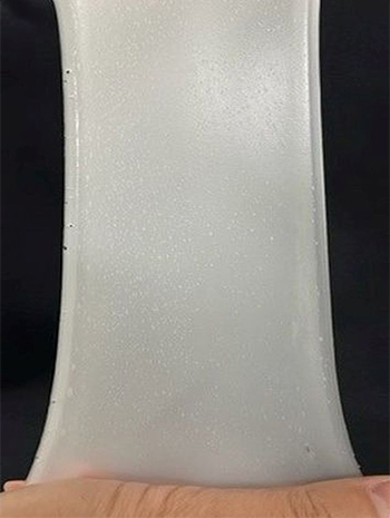 This photo shows the excellent pliability and superior extendability of Shin-Etsu's silicone.